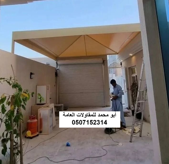 تركيب مظلات سيارات قماش PVC ومظلات كيسان حديثة في الدمام والخبر لحماية المركبات من حرارة الشمس.